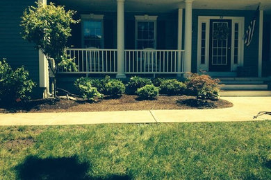 Photo of a mid-sized traditional partial sun front yard landscaping in Boston for spring.