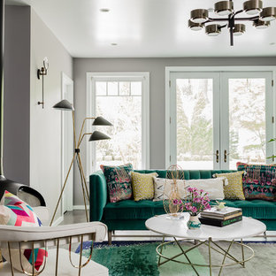 Bild på ett mellanstort funkis separat vardagsrum, med ett finrum, grå väggar, mellanmörkt trägolv, en hängande öppen spis och brunt golv