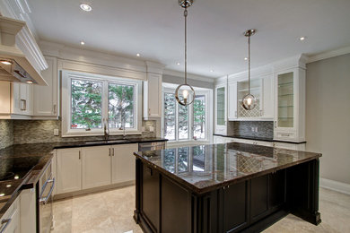 Large minimalist u-shaped marble floor kitchen photo in Toronto with an undermount sink, shaker cabinets, marble countertops, mosaic tile backsplash, stainless steel appliances and an island