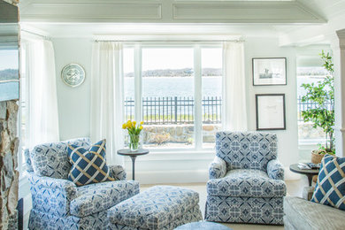 Living room - mid-sized coastal open concept carpeted and brown floor living room idea in Boston with white walls, a standard fireplace, a stone fireplace and a wall-mounted tv