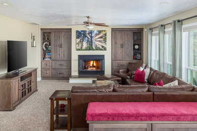 Example of a mid-sized transitional carpeted and beige floor family room design in Boise with a standard fireplace