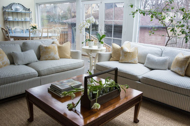 Family room - large traditional open concept family room idea in Toronto with yellow walls and a media wall