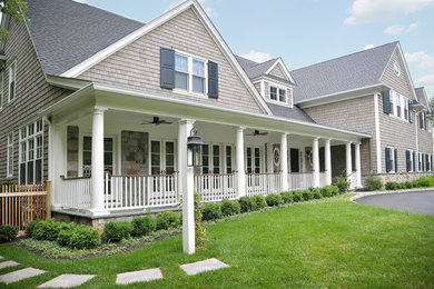 Huge traditional gray two-story wood gable roof idea in New York