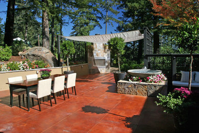 Inspiration for a large contemporary backyard concrete patio remodel in San Francisco with a fire pit