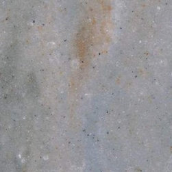Corian&reg; Juniper has light red veins & blue particles embedded in a warm base. - Products
