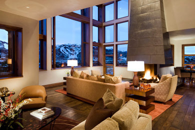 Contemporary formal open concept living room in Denver with a corner fireplace.