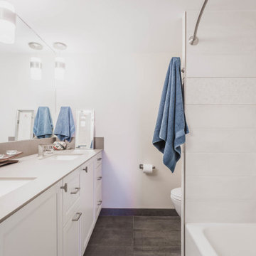 Primary Bathroom with Double Vanity and Tub Shower