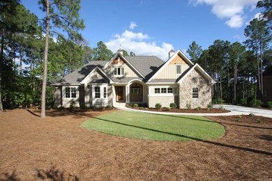 Mid-sized craftsman beige two-story mixed siding house exterior idea in Raleigh with a hip roof and a shingle roof