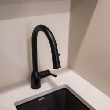Black Undermount Sink in Veined White Quartz