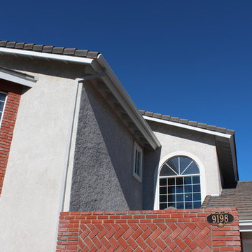 Curved Face Seamless Rain Gutters with smooth Box Downspouts in Cypress Californ