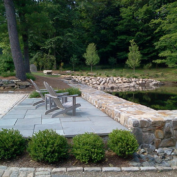 Pond dredging after flagstone terrace