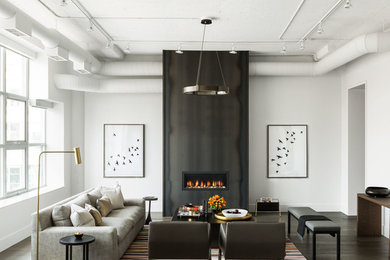 Inspiration for a large transitional formal enclosed living room in Toronto with white walls, dark hardwood floors, a ribbon fireplace, a metal fireplace surround, no tv and brown floor.