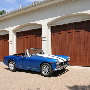 Inspiration for a large contemporary attached three-car garage remodel in Austin