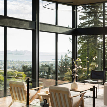 Living room with panoramic San Francisco Bay and Bay Bridge views through floor-