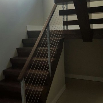 Open riser stairs with stainless steel cable wire railing