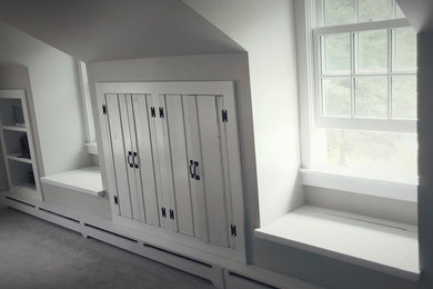 Inspiration for a mid-sized cottage enclosed carpeted game room remodel in Milwaukee with gray walls, no fireplace and a wall-mounted tv