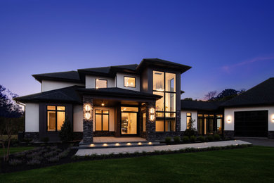 Inspiration for a mid-sized modern two-story house exterior remodel in Other