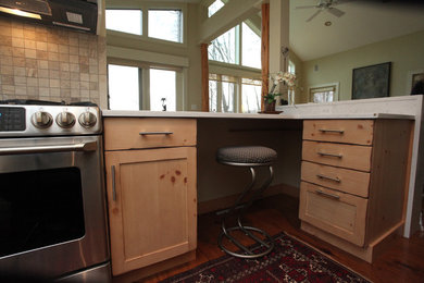 Inspiration for a transitional medium tone wood floor kitchen remodel in New York with an undermount sink, shaker cabinets, white cabinets, quartz countertops, stone tile backsplash and stainless steel appliances