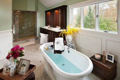 Large elegant master beige tile and ceramic tile ceramic tile and beige floor bathroom photo in Other with recessed-panel cabinets, dark wood cabinets, a one-piece toilet, green walls, a drop-in sink and a hinged shower door