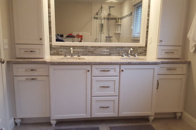 WHITE CUSTOM CABINETRY BY SPECIAL ADDITIONS WITH OVERSIZED MIRROR
