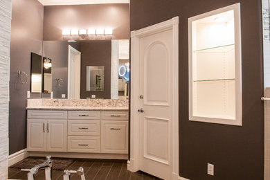 Inspiration for a mid-sized modern master beige tile, brown tile and mosaic tile dark wood floor and brown floor corner shower remodel in Other with raised-panel cabinets, white cabinets, an undermount tub, brown walls, a vessel sink, granite countertops and a hinged shower door