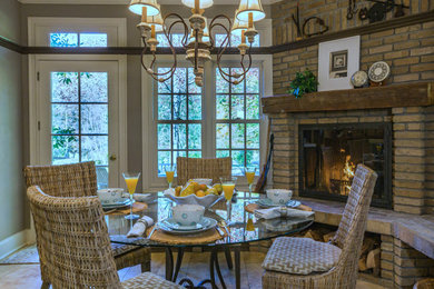 Country ceramic tile and multicolored floor eat-in kitchen photo in Cleveland with a double-bowl sink, beaded inset cabinets, brown cabinets, limestone countertops, multicolored backsplash, marble backsplash, stainless steel appliances, an island and multicolored countertops