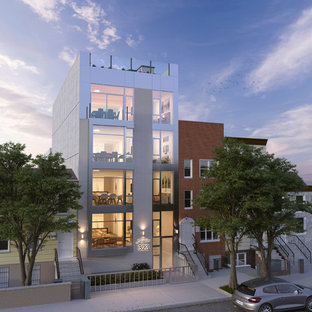 Удачное сочетание для дизайна помещения: трехэтажный фасад многоквартирного дома среднего размера бежевого цвета в стиле модернизм с облицовкой из кирпича, плоской крышей и черепичной крышей - самое интересное для вас