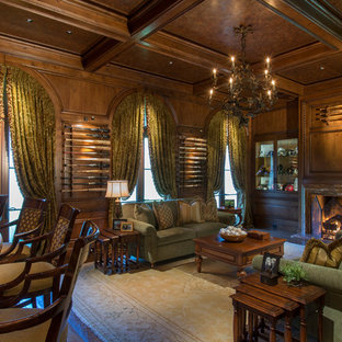 Photo of a medium sized mediterranean enclosed living room in Miami with medium hardwood flooring, a standard fireplace, a wooden fireplace surround and brown floors.