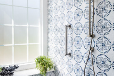 Large transitional master blue tile and porcelain tile white floor, single-sink and porcelain tile bathroom photo in Charlotte with white cabinets, blue walls, quartz countertops, white countertops, a niche, shaker cabinets, a two-piece toilet and an undermount sink