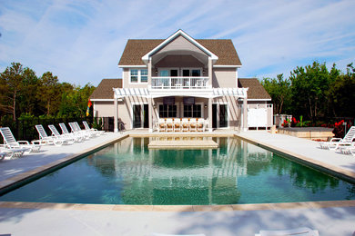 Beach style home design photo in Other
