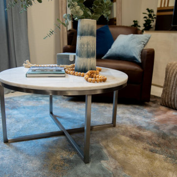 Nico Round Coffee Table Brings Soft Shape and Function to the Basement