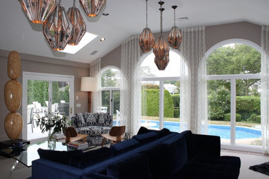 Mid-sized trendy open concept carpeted and white floor family room photo in New York with brown walls