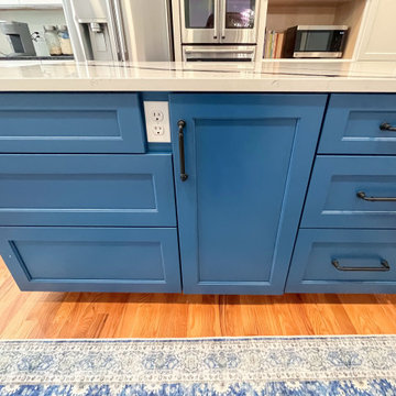 Kitchen with White Perimeter and Blue Island Cabinet Reface