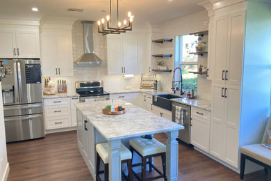Kitchen - country dark wood floor and brown floor kitchen idea in Miami with shaker cabinets, white cabinets, quartzite countertops, an island and gray countertops