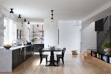 Inspiration for a large contemporary medium tone wood floor kitchen/dining room combo remodel in Austin with white walls and no fireplace