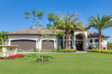 Tuscan one-story exterior home photo in Miami