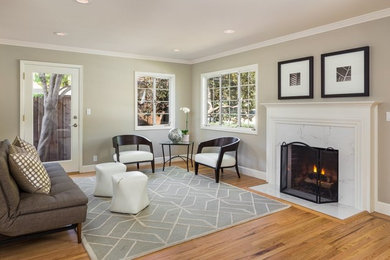 Inspiration for a mid-sized contemporary enclosed light wood floor living room remodel in San Francisco with gray walls, a standard fireplace and a tile fireplace