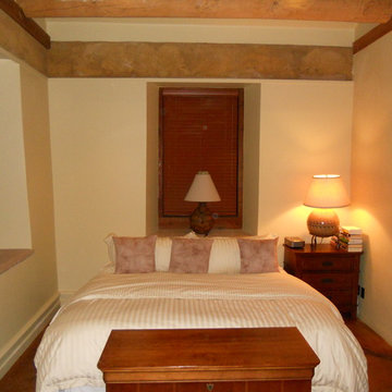 Adobe house dust control. Sheetrock level finish in bedroom.