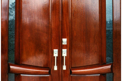 Asian entryway photo in Orlando with a medium wood front door