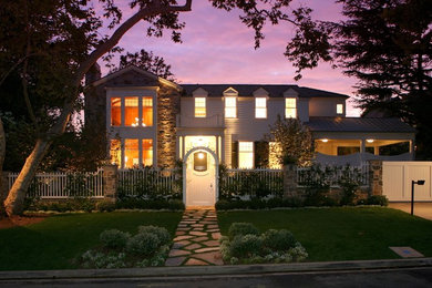 This is an example of a traditional exterior in Los Angeles with wood siding.