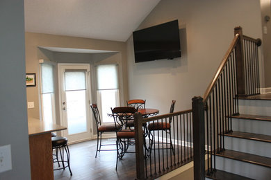 Small elegant dark wood floor kitchen/dining room combo photo in Kansas City with gray walls