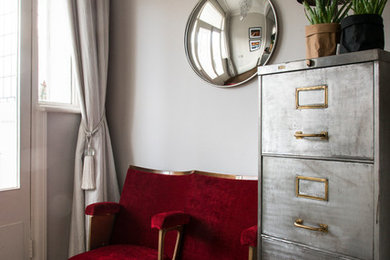 Inspiration for a mid-sized contemporary laminate floor and brown floor home office remodel in London with gray walls