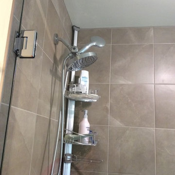 Enlarge bathroom, convert bedroom closet into bathroom shower. Full remodel.