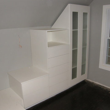Sloped Ceiling Walk-In Closet by Closets For Life