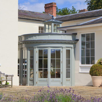 Curved orangery makes the most of an unused corner courtyard