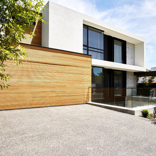 Photo of a modern two-storey multi-coloured house exterior in Melbourne with mixed siding and a flat roof.