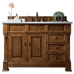 James Martin Vanities - Brookfield 48" Single Vanity, Country Oak w/ 3 CM Arctic Fall Solid Surface Top - The Brookfield 48" Country Oak vanity by James Martin Vanities features hand carved accenting filigrees and raised panel doors. Two doors open to shelves for storage below. Two drawers made up of a lower double-height drawer and a middle standard drawer, offer additional storage space, with antique brass finish door and drawer pulls. Matching wood backsplash is included. The look is completed with a 3cm eased edge Arctic Fall Solid Surface top with a white porcelain rectangular sink.
