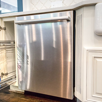 A pull-out rack next to the Kitchenaid DW provides access to cleaning suppl
