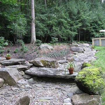 Dry River Bed with Boulders and Stone Bridge