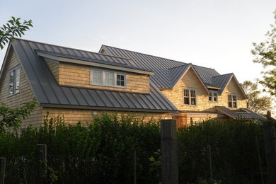 Example of an arts and crafts house exterior design in Philadelphia with a metal roof